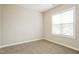 Bedroom featuring neutral paint, carpet, and a bright window at 123 Pleasant View Ln, Benson, NC 27504