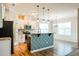 Spacious kitchen flowing into the dining area, featuring granite countertops, stainless steel appliances, and white cabinetry at 123 Pleasant View Ln, Benson, NC 27504