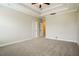 Spacious main bedroom featuring neutral paint, carpet and decorative tray ceiling at 123 Pleasant View Ln, Benson, NC 27504