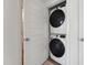 Modern laundry area showcases stacked washer and dryer units for space-saving convenience at 138 N White St # 100, Wake Forest, NC 27587