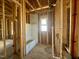 Framed bathroom features a window and new tub installation, ready for finishing touches at 139 W Crescent Mills Blvd # Homesite 235, Wilson's Mills, NC 27520