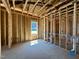 Framed bedroom highlighting new window installation and exposed beams at 139 W Crescent Mills Blvd # Homesite 235, Wilson's Mills, NC 27520