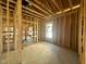 Framed bedroom with new window shows room's layout potential and natural light at 139 W Crescent Mills Blvd # Homesite 235, Wilson's Mills, NC 27520