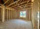 Framed bedroom displays window with views of neighborhood at 139 W Crescent Mills Blvd # Homesite 235, Wilson's Mills, NC 27520