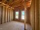Interior framing of a new construction home showcasing the layout and natural light through the windows at 139 W Crescent Mills Blvd # Homesite 235, Wilson's Mills, NC 27520