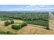 Wide aerial view of the land revealing lush greenery, roads, and open areas at 1401 Berea Rd, Rougemont, NC 27572