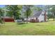 Spacious backyard featuring a deck, storage shed, and ample room for outdoor activities at 1401 Berea Rd, Rougemont, NC 27572