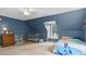 This cozy bedroom offers natural light and carpet flooring at 1401 Berea Rd, Rougemont, NC 27572