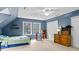 This inviting bedroom features two windows, carpet, and a ceiling fan at 1401 Berea Rd, Rougemont, NC 27572