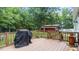 This deck features an outdoor space, railing and a grill at 1401 Berea Rd, Rougemont, NC 27572