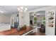 Open dining room with stainless steel refrigerator flowing into living space at 1401 Berea Rd, Rougemont, NC 27572