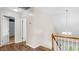 Light-filled hallway with wood floors and stairs leading to an upper level at 1401 Berea Rd, Rougemont, NC 27572
