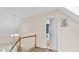 This hallway features stairs and a bedroom door at 1401 Berea Rd, Rougemont, NC 27572