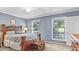 Spacious main bedroom with two windows and neutral-toned walls at 1401 Berea Rd, Rougemont, NC 27572