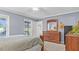 Main bedroom featuring a large dresser, backyard view and private entrance at 1401 Berea Rd, Rougemont, NC 27572