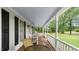 Relaxing porch with seating, perfect for enjoying the scenic outdoor views at 1401 Berea Rd, Rougemont, NC 27572