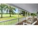Inviting porch with rocking chairs and views of the lush, green yard at 1401 Berea Rd, Rougemont, NC 27572