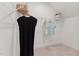Walk-in closet features wire shelving for organized storage and carpeted floors for a comfortable feel to the space at 142 N White St # 100, Wake Forest, NC 27587