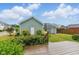 Green backyard with lush shrubs, shed, and patio perfect for relaxation at 1448 Big Falls Dr, Wendell, NC 27591
