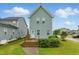 Charming home exterior with a manicured lawn and wooden deck perfect for outdoor enjoyment at 1448 Big Falls Dr, Wendell, NC 27591