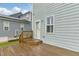 Spacious wooden deck with access to the backyard and a glimpse of the neighborhood at 1448 Big Falls Dr, Wendell, NC 27591