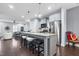 Spacious kitchen with a large island, stainless steel appliances, and open layout into the living area at 1448 Big Falls Dr, Wendell, NC 27591