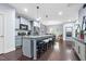 Modern kitchen featuring a center island with seating, open to the dining area, perfect for Gathering gatherings at 1448 Big Falls Dr, Wendell, NC 27591