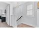 Bright stairway features carpeted steps and a window with shutters at 1448 Big Falls Dr, Wendell, NC 27591