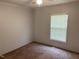 Bedroom features a large window, neutral colored walls, and plush carpet at 145 Country Walk Ln, Sanford, NC 27332