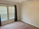 Bedroom featuring neutral colored walls, plush carpet, and lots of natural light at 145 Country Walk Ln, Sanford, NC 27332