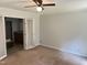 Cozy bedroom with neutral walls, plush carpet, a ceiling fan, and natural lighting at 145 Country Walk Ln, Sanford, NC 27332