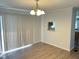 Dining room featuring hardwood floors, a chandelier, and natural light at 145 Country Walk Ln, Sanford, NC 27332