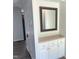Entryway with white cabinets, a mirror, and outlets, blending functionality with modern design at 145 Country Walk Ln, Sanford, NC 27332