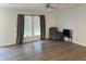 Bright living room featuring wood-look flooring, neutral walls and a ceiling fan at 145 Country Walk Ln, Sanford, NC 27332