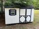 White shed features black trim around the window and the doors at 145 Country Walk Ln, Sanford, NC 27332