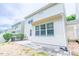 Exterior shot showing white vinyl siding and the back of the home at 145 Torrey Heights Ln, Durham, NC 27703