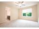 Cozy bedroom features neutral carpet, natural light from a window, and an ensuite bathroom at 145 Torrey Heights Ln, Durham, NC 27703