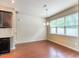 Bright dining area features hardwood floors, large window with natural light, and modern chandelier at 145 Torrey Heights Ln, Durham, NC 27703