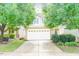 Charming two-story home featuring a two-car garage and manicured front yard with mature trees at 145 Torrey Heights Ln, Durham, NC 27703