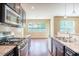 Well lit Kitchen showcasing stainless appliances, granite countertops, and lots of cabinetry at 145 Torrey Heights Ln, Durham, NC 27703