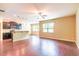 Open-concept living room with hardwood floors, recessed lighting, and a view of the kitchen at 145 Torrey Heights Ln, Durham, NC 27703