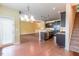 Open living space showcases hardwood floors, a modern kitchen, and an outdoor patio entrance at 145 Torrey Heights Ln, Durham, NC 27703