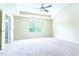 Bright main bedroom with carpeted floor, ceiling fan, tray ceiling and ensuite bathroom at 145 Torrey Heights Ln, Durham, NC 27703