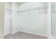 Spacious walk-in closet featuring ample shelving for optimized storage at 145 Torrey Heights Ln, Durham, NC 27703