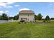 Spacious backyard featuring a pergola, raised garden beds and a well-manicured lawn at 15 Scuppernong Ln, Lillington, NC 27546