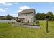 Large backyard with grass, landscaping, and a pergola at 15 Scuppernong Ln, Lillington, NC 27546
