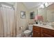 Bathroom featuring a toilet, vanity, shower, and neutral decor at 15 Scuppernong Ln, Lillington, NC 27546