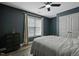 Bedroom with wood-look flooring and a ceiling fan at 15 Scuppernong Ln, Lillington, NC 27546