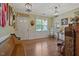 Inviting entryway featuring a wooden bench, elegant decor, and hardwood floors at 15 Scuppernong Ln, Lillington, NC 27546