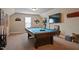 Game room featuring a pool table, movie posters, and decorations at 15 Scuppernong Ln, Lillington, NC 27546